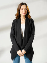 Front view of the black Ash Front Open Overlayer with a slim fit, worn with a white top and blue jeans.