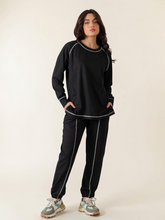 Berlin Black summer co-ord set for women featuring a longer-length raglan sleeve top with contrast stitching and matching trousers.