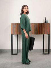 The Blair Evergreen double-knit co ord set with a relaxed top and matching wide-leg trousers, shown from the side