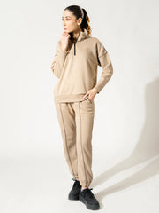 Calca Natural Sand women's quarter-zip fleece co ord set with a high standing collar and matching relaxed trousers
