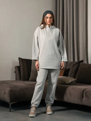 Front view of the Darya Heather Grey oversized hoodie set showing the long hoodie with a curved hem and matching trousers.