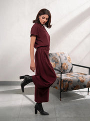 Full-length view of Jax Mulberry matching set featuring a button-down top and flowing wide-leg trousers