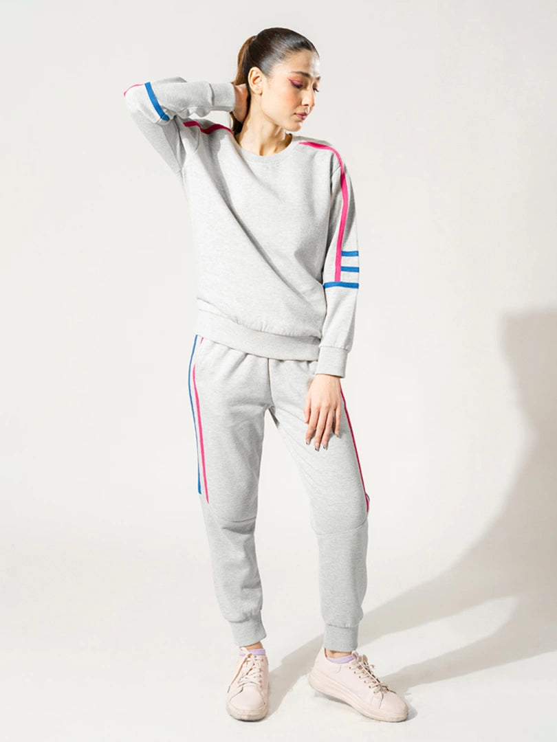 Michi Heather Grey fleece sweat set for women, featuring a matching sweatshirt and trousers with pink and blue contrast stripes.