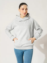 Front view of the Naia fleece pullover hoodie in Heather Grey, showing its overlapping hood and front pockets.
