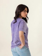 Side and back angled view of the Sage Oversized Tee in Mineral Wash Purple, showing its loose fit and short sleeves.
