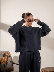 Model styling the Soho Midnight Blue boxy hoodie with matching wide-leg trousers