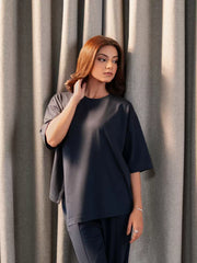 Closer front view of the Sorelle Oxford Blue top showing its round neckline, dropped shoulders and loose sleeves.