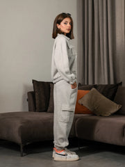 Side view of the Varley Heather Grey winter co-ord set showing the zip-up jacket and cargo trouser silhouette