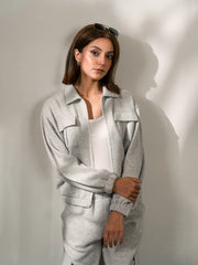 Closer view of the Varley Heather Grey zip-up jacket showing the collar, front opening and relaxed fit