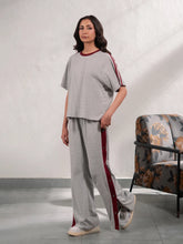 Zoey Heather Grey summer co-ord set for women featuring a loose-fit top with contrast sleeve tape and matching wide-leg trousers.