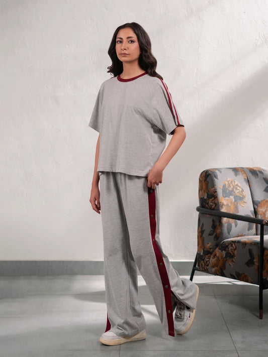 Zoey Heather Grey summer co-ord set for women featuring a loose-fit top with contrast sleeve tape and matching wide-leg trousers.