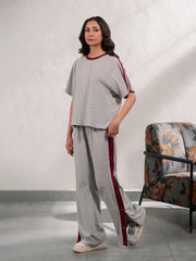 Zoey Heather Grey summer co-ord set for women featuring a loose-fit top with contrast sleeve tape and matching wide-leg trousers.