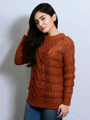 Woman wearing a brown knitted sweater against a plain background