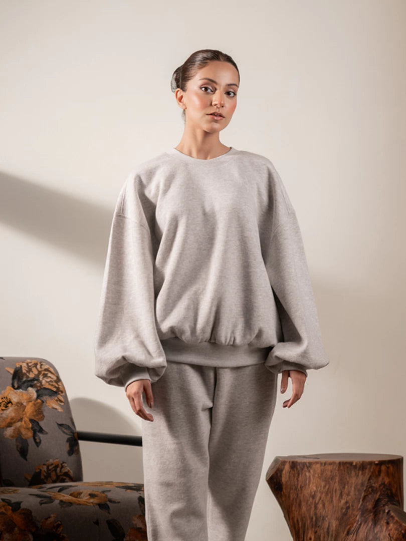 Front view of the Barlow oversized sweatshirt in Heather Grey, showing its voluminous balloon sleeves and relaxed fit.