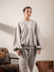Front view of the Barlow oversized sweatshirt in Heather Grey, showing its voluminous balloon sleeves and relaxed fit.