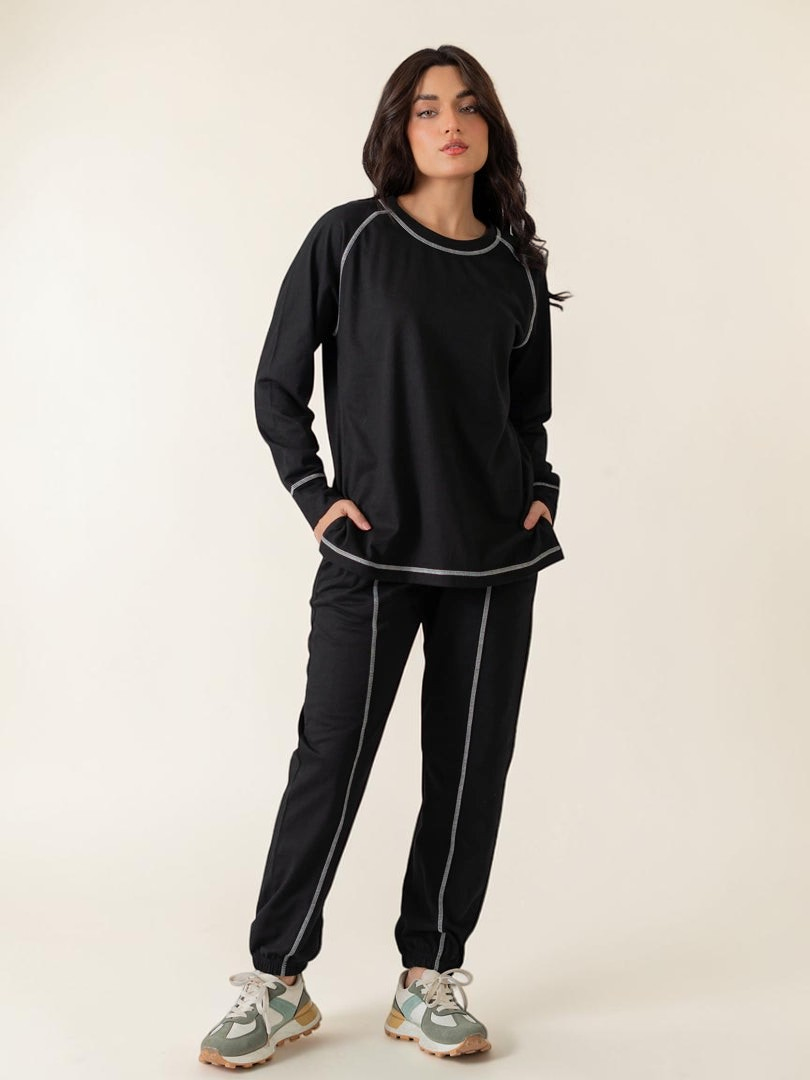 Berlin Black summer co-ord set for women featuring a longer-length raglan sleeve top with contrast stitching and matching trousers.