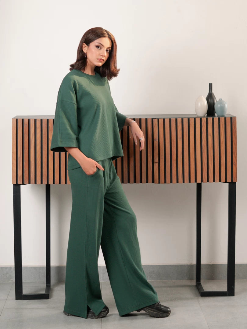 Full-length angled view of The Blair Evergreen green matching set with a relaxed-fit top and wide-leg trousers
