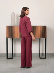 Back and side view of The Blair Plum two-piece set showing the relaxed top and wide-leg trouser silhouette
