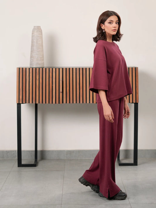 The Blair Plum women's co ord set featuring a relaxed double-knit top and matching wide-leg trousers