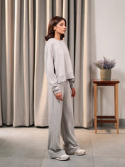 Side view of the Brooklyn Heather Grey matching set showing the boxy top and wide-leg trouser silhouette.