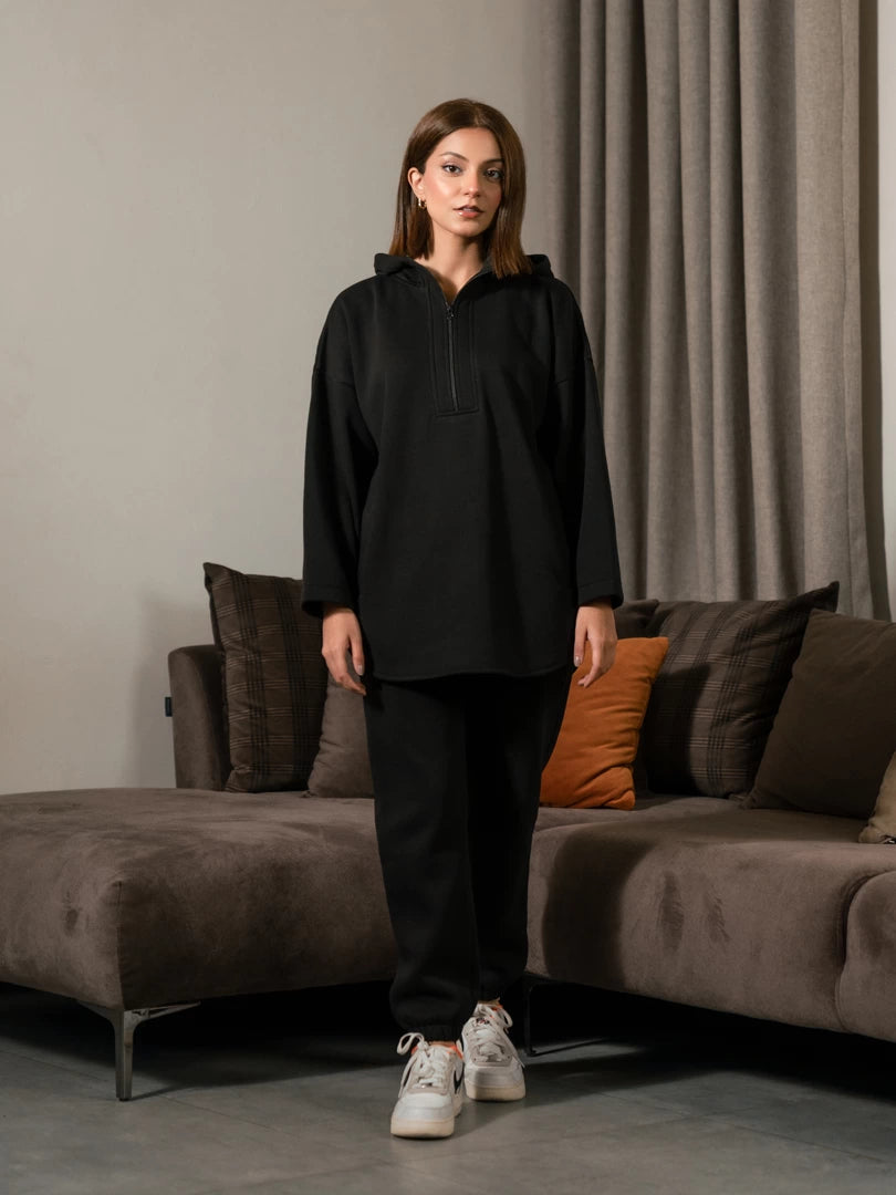 Front view of the Darya black oversized hoodie matching set showing the long hoodie and matching trousers.