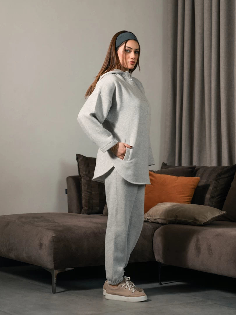 Side view of the Darya Heather Grey matching set showing the longline hoodie, hood and matching trousers.