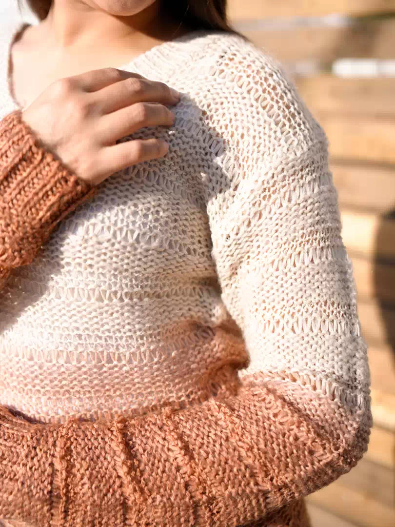 Close-up of the sleeve and textured knit of Coastline's Dip Dyed Sweater in Dusty Tan.