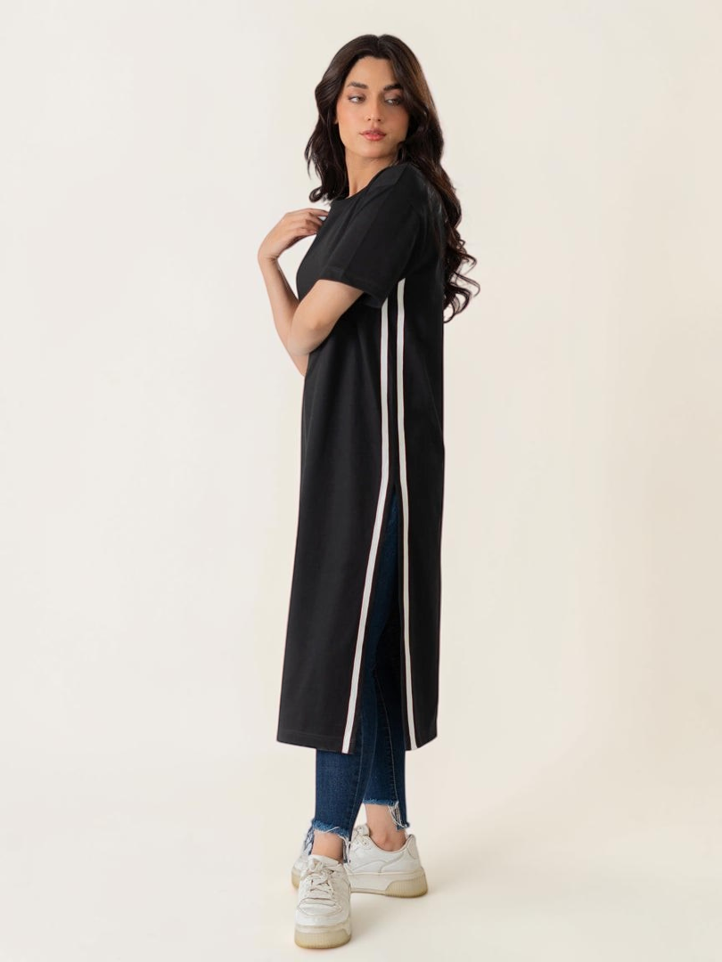 Model wearing Coastline's Eve Side Slit Maxi Dress in Black, featuring contrast tape detailing and a long side slit.