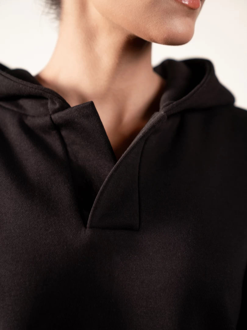 Close-up of the Garconne Black hoodie's open front placket and neckline, showing the hood construction and fabric detail.
