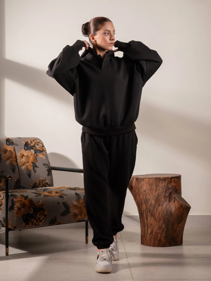 Garconne Black oversized hoodie matching set for women, featuring a relaxed hoodie and matching cuffed trousers.