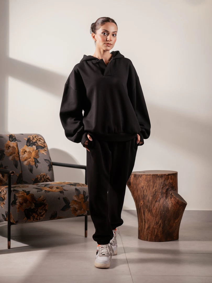 Full-length front view of the Garconne Black winter co ord set with an oversized hoodie and elasticated-hem trousers.