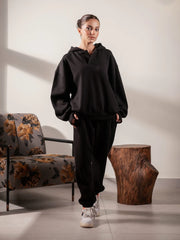 Full-length front view of the Garconne Black winter co ord set with an oversized hoodie and elasticated-hem trousers.