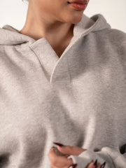 Close-up of the Garconne Heather Grey hoodie's neckline and open front placket, showing its double-layer hood and fleece texture.