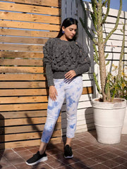 Model wearing Coastline's Chunky Body Hugging Giselle Sweater in Sparkling Gray, styled with light blue tie-dye bottoms.