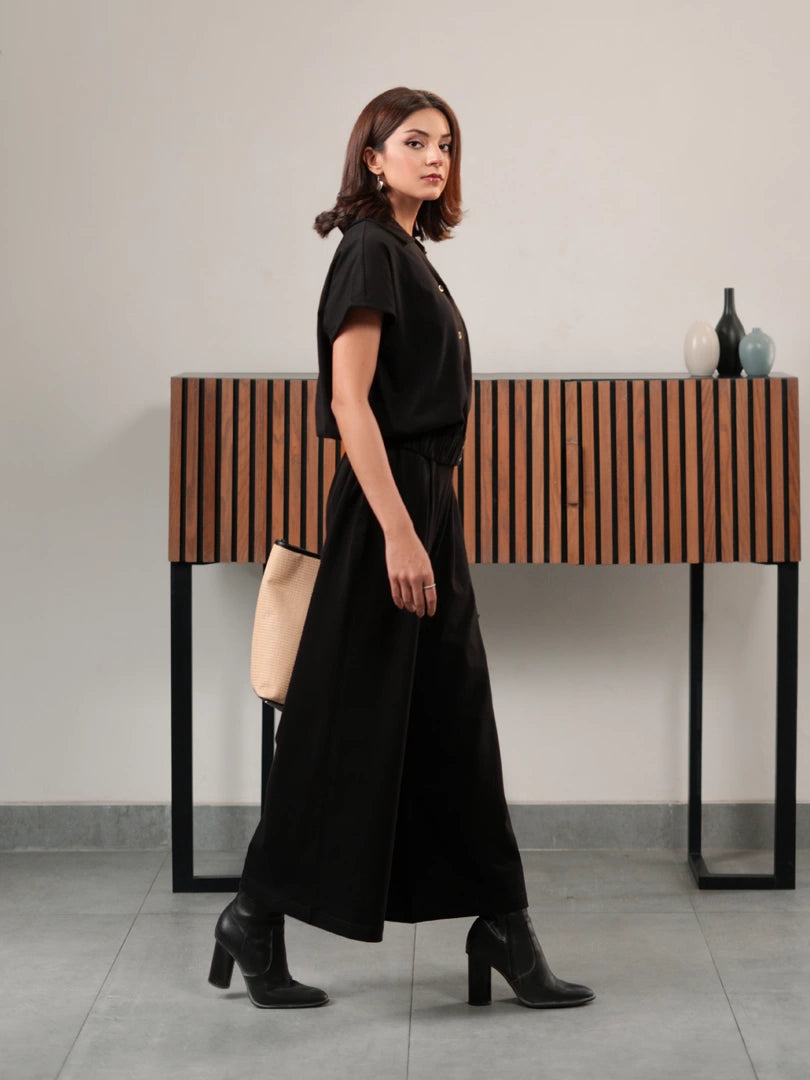 Jax Black button-down co-ord set for women, featuring a collared short-sleeve top and high-rise wide-leg trousers.