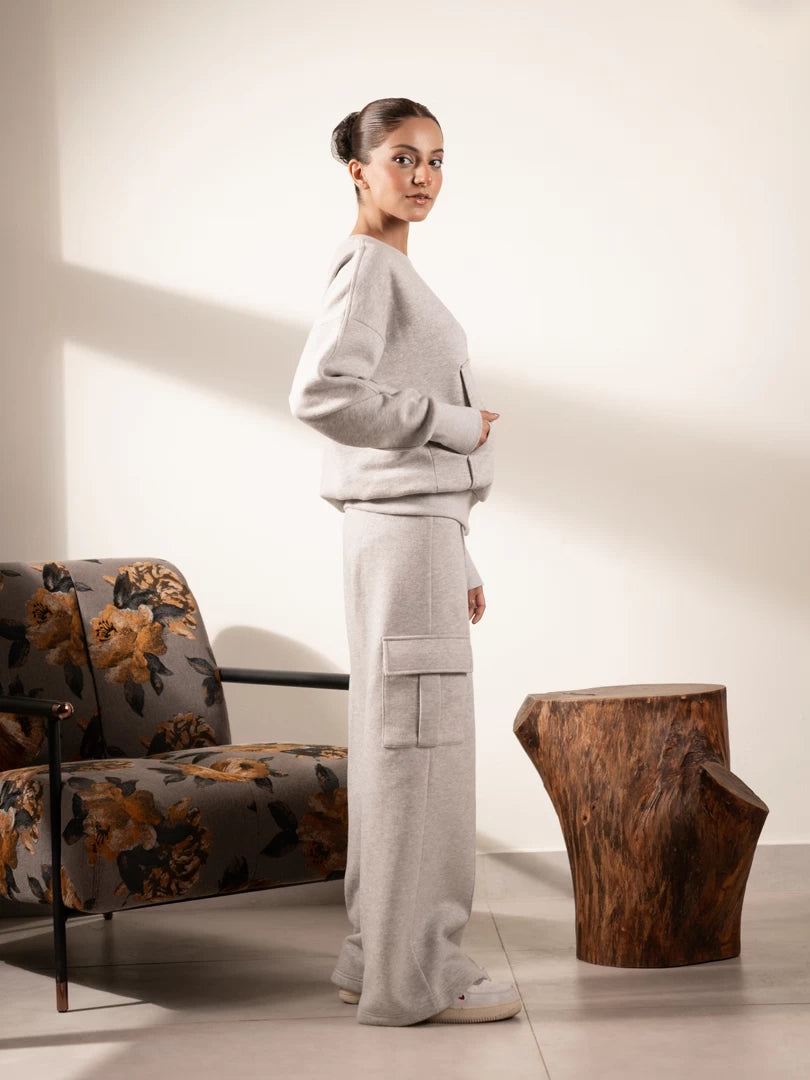 Full-length view of the Kangroo Heather Grey sweatshirt and trouser set showing the relaxed silhouette and cargo pockets.