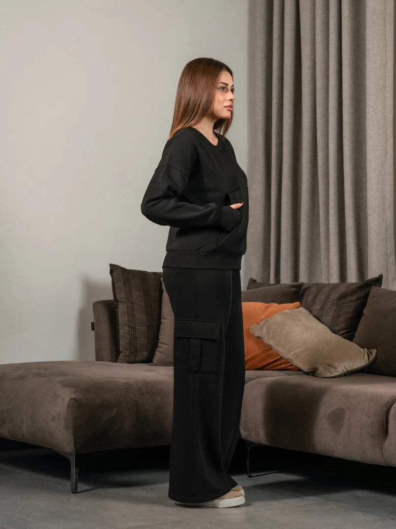 Side view of the black Kangroo Winter Matching Set showing the sweatshirt and trouser silhouette.
