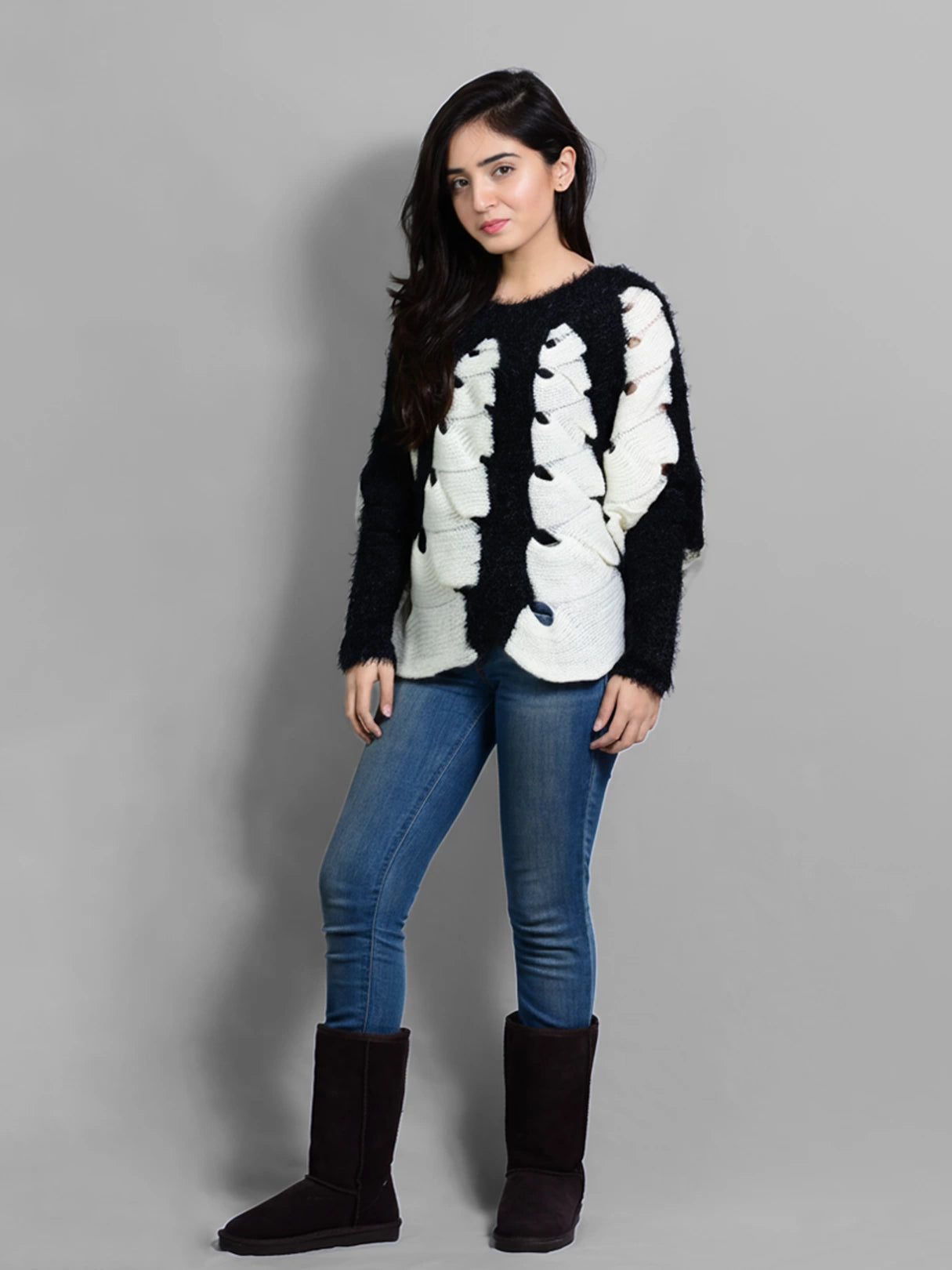 Front standing view of the Kate Fuzzy Sweater by Coastline, showing its black and white textured design.