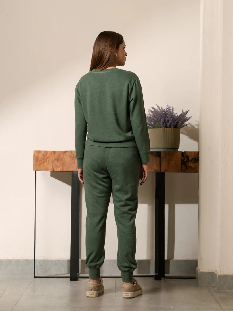 Back view of the Kiwi green winter co-ord set showing the sweatshirt hem and matching trousers.