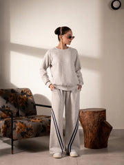 Lana Heather Grey striped sweat set for women featuring a long-sleeve sweatshirt and matching wide-leg trousers with contrast side stripes.