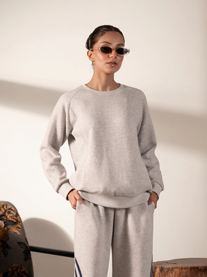 Front view of the Lana Heather Grey sweatshirt and trouser set with panel detailing and contrasting stripes along the trousers.