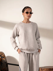 Front view of the Lana Heather Grey sweatshirt and trouser set with panel detailing and contrasting stripes along the trousers.