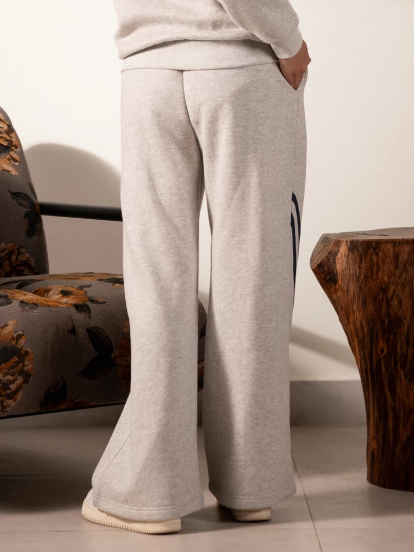 Back view of the Lana Heather Grey wide-leg trousers showing their relaxed shape and full-length hems.