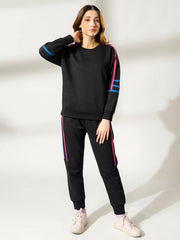 Full-length front view of the Michi Black winter co ord set with a relaxed sweatshirt and matching black trousers.