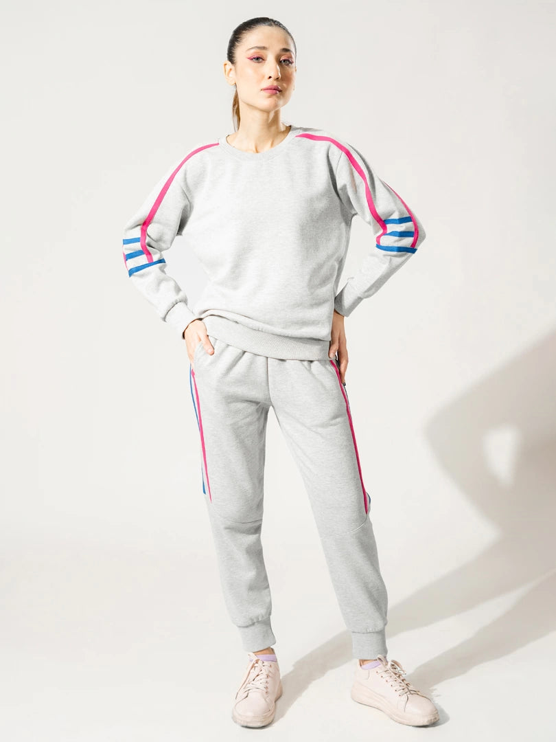 Full-length front view of the Michi Heather Grey winter co ord set with colourful tape detailing along the sleeves and trousers.