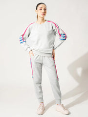 Full-length front view of the Michi Heather Grey winter co ord set with colourful tape detailing along the sleeves and trousers.