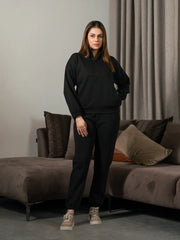 Ronin Black half-zip matching set for women, featuring a stand-neck sweatshirt and matching relaxed-fit trousers.