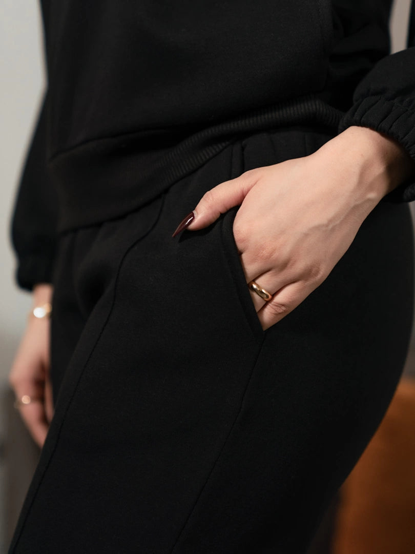 Close-up of the Ronin Black matching set trousers showing the side pocket and comfortable casual fit.