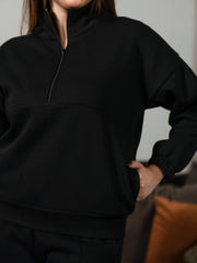 Closer front view of the Ronin Black sweatshirt showing its stand-neck collar, half-zip fastening and relaxed fit.