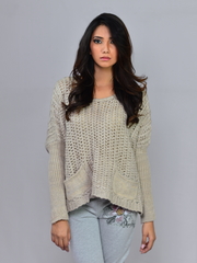 Model wearing Coastline's Sienna Chunky Sweater in Sand, showing the relaxed fit and textured knit design.
